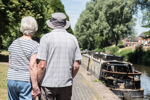 Couple walking along the Trent & Mersey Canal